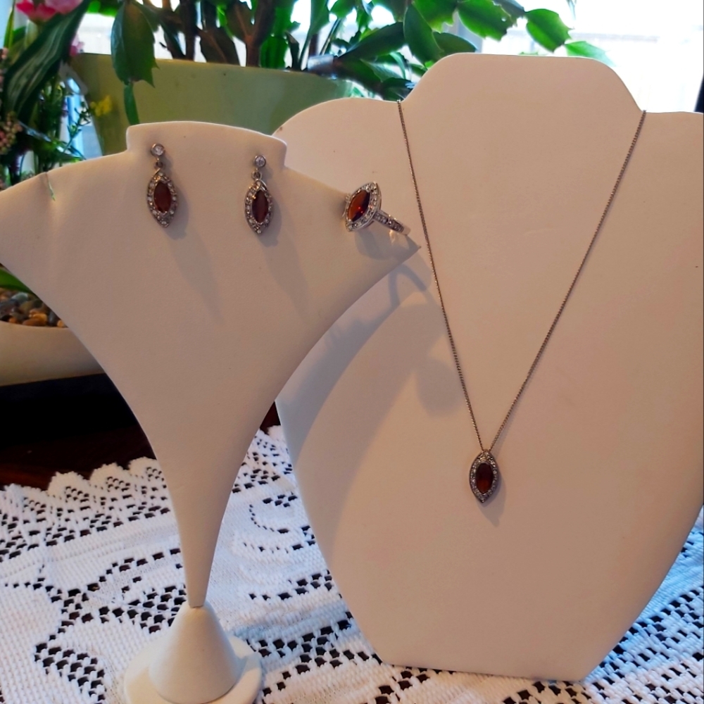 Avon ( topaz)4 piece(earrings,necklace&ring)